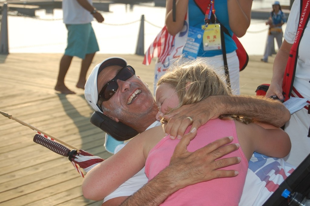 A big hug for Nick Scandone winner of the Gold Medal for the USA in the SKUD 19 class at the 2008 Paralympics    © Dan Tucker http://sailchallengeinspire.org/